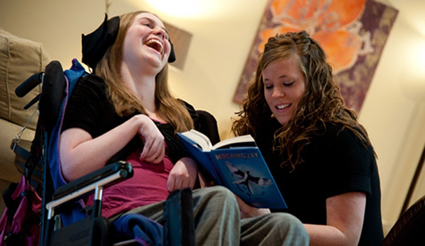 Friends reading a book together